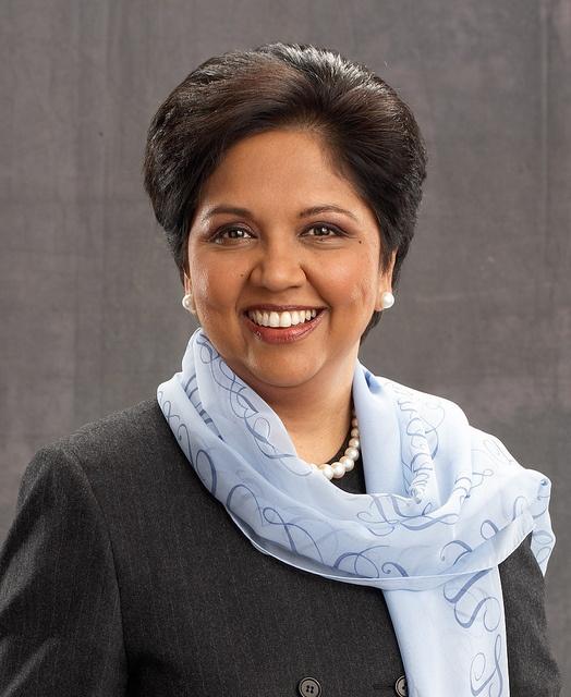 a woman in a black jacket and scarf