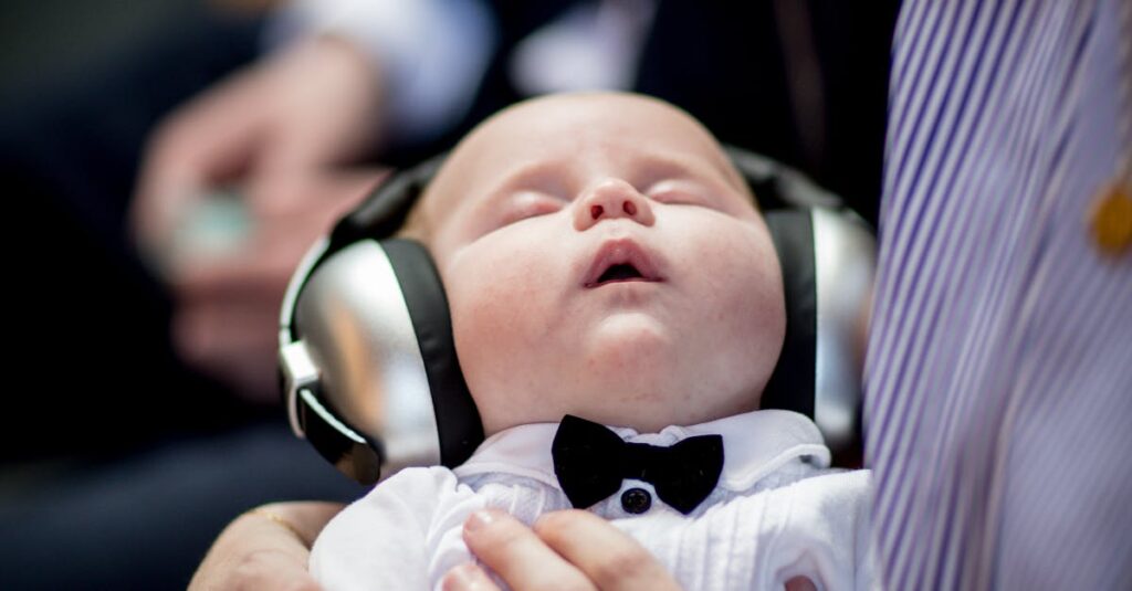 नींद और मस्तिष्क का विज्ञान: जानिए कैसे नींद हमारे दिमाग को बदलती है 1 A cute baby wearing headphones and a bow tie sleeping peacefully in an indoor setting. नींद और मस्तिष्क (Sleep and Brain): एक अद्भुत रिश्ता