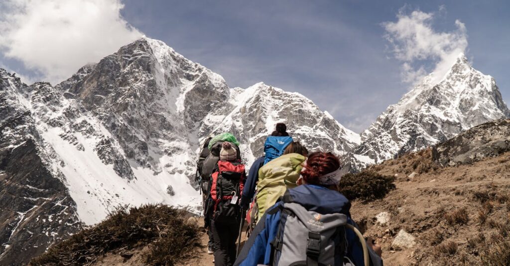 हिमालय में ट्रेकिंग: केदारनाथ और अन्य रास्तों की तैयारी | Trekking in Himalayas Guide in Hindi 2 Group of hikers trekking on a sunny day with snow-capped mountains in the background. Outdoor adventure scene.
हिमालय में ट्रेकिंग: केदारनाथ और अन्य रास्तों की तैयारी | Trekking in Himalayas Guide in Hindi