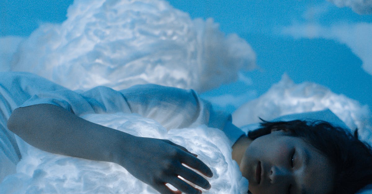Woman peacefully sleeping, surrounded by soft clouds, evoking dreams and serenity. 10 Amazing Dream Facts जो नींद के पीछे की दुनिया को खोलते हैं