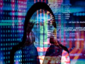 A woman with digital code projections on her face, representing technology and future concepts. AI और 2026 का जॉब मार्केट: चुनौतियां, अवसर और भविष्य की तैयारी