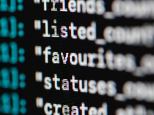 Extreme close-up of computer code displaying various programming terms and elements.